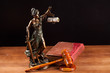judge gavel Temida statue and law book