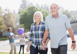 Older couple walking together outdoors
