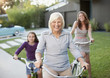 Three generations of women riding bicycles