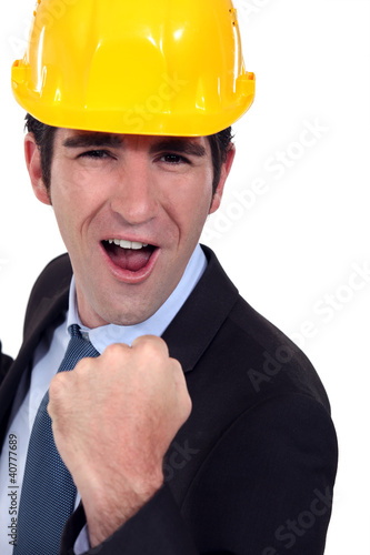 Photo: Man with helmet jubilant Man with helmet jubilant