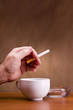 Hand holding a cigarette