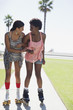 Women skating together in park