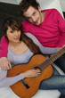Couple playing the guitar