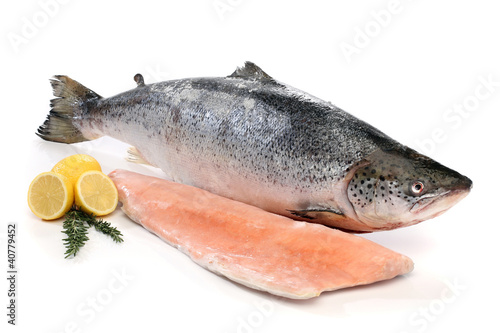 Photo: Big salmon fish and a fillet isolated on white Big salmon fish and a fillet isolated on white