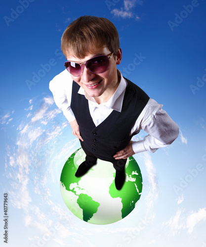 Illustration: Young businessman and our planet earth Young businessman and our planet earth