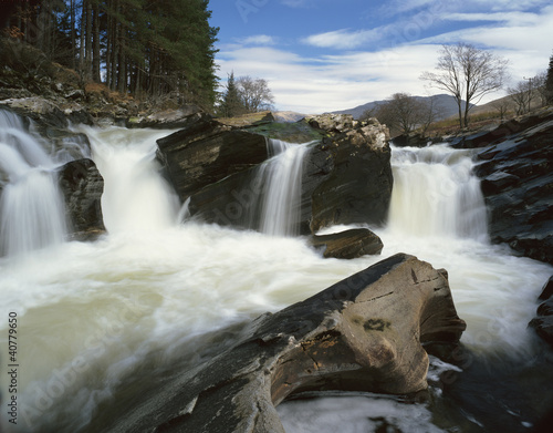Photo: Time lapse view of rocky waterfall Time lapse view of rocky waterfall