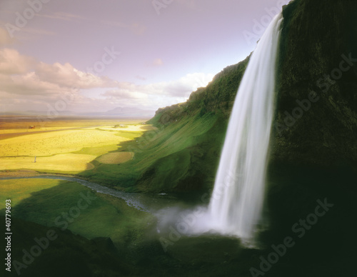 Photo: Time lapse view of waterfall over cliff Time lapse view of waterfall over cliff
