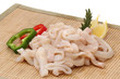 Pile of raw squid rings over white Pile of raw squid rings over white