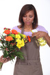 Young woman florist on white background
