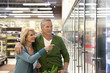 Older couple shopping in supermarket