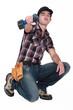 Young worker with drill
