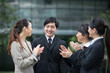Photo: Business team applauds each other. Business team applauds each other.