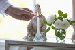 Man lighting candle in living room