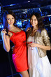 Attractive woman in night club with a drink Attractive woman in night club with a drink