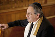 Rabbi sitting in synagogue pew