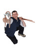craftsman holding a tool for bending metal craft