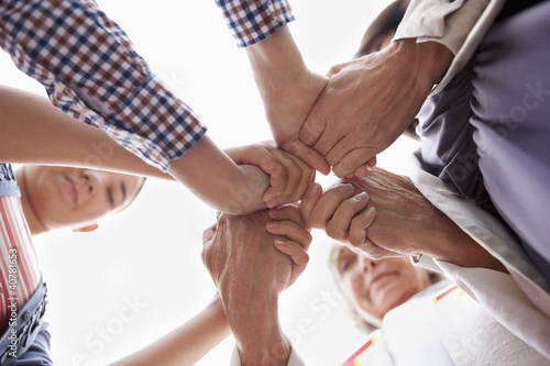 Photo: Group of hands clasped in prayer Group of hands clasped in prayer