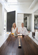 Couple meditating together in living room