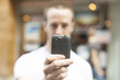 Men take photo with mobile phone Men take photo with mobile phone