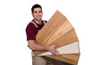 Man displaying variety of laminate flooring