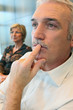 Man watching something thoughtfully