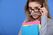 Geeky looking woman with folders Geeky looking woman with folders