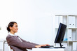 Young woman in business wear working in office