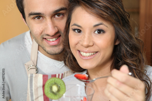 Photo: Young man feeding his girlfriend strawberries Young man feeding his girlfriend strawberries