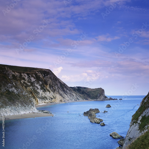 Photo: Rocky cliffs on still bay Rocky cliffs on still bay