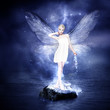 Magical young blond woman as fairy