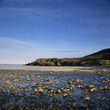 Waves washing up on rocky beach