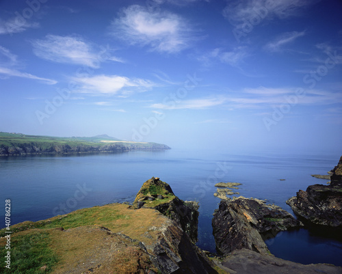 Photo: Rocky cliffs overlooking ocean Rocky cliffs overlooking ocean