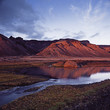 Rock formations reflected in still river