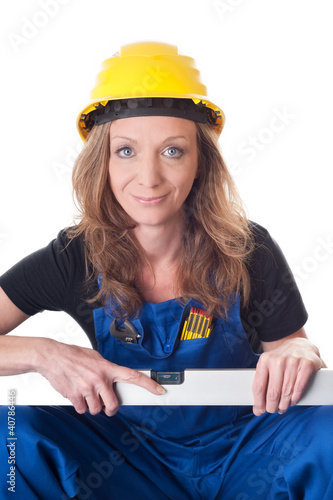 Foto: Frau mit Wasserwaage - woman with level Frau mit Wasserwaage - woman with level