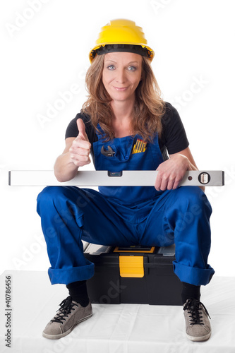 Foto: Frau mit Wasserwaage - woman with level Frau mit Wasserwaage - woman with level