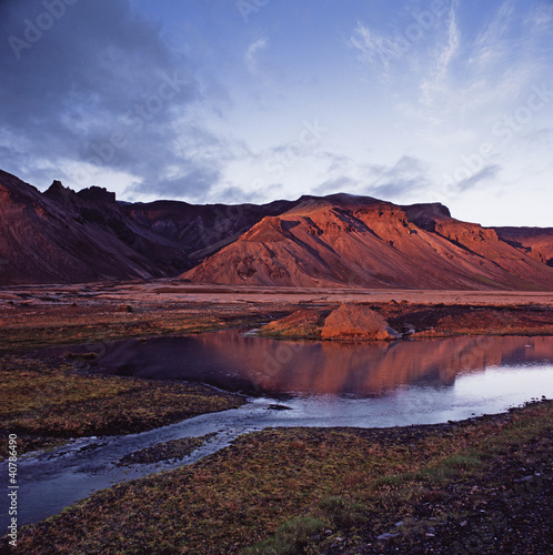 Photo: Rock formations reflected in still river Rock formations reflected in still river
