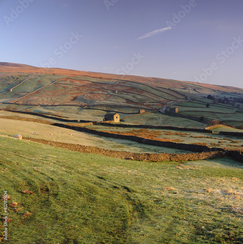 Photo: Houses and stone walls in rural landscape Houses and stone walls in rural landscape