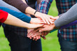 Multiracial Students with Hands on Stack