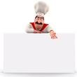 Happy chef pointing towards sign