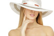 Closeup of female in white summer hat hiding her eyes