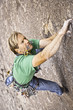Rock climber struggles.