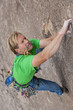 Rock climber struggles.