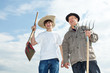 Farmer with an apprentice in the field