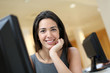 Smiling office worker at ther desk