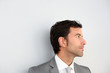 Businessman standing on white wall