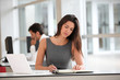 Attractive businesswoman working on laptop computer