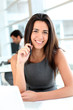 Attractive businesswoman working on laptop computer