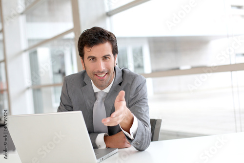 Photo: Portrait of businessman in meeting Portrait of businessman in meeting
