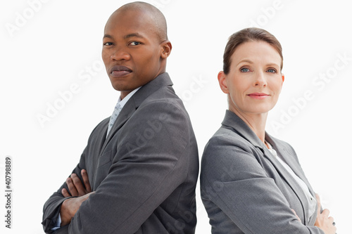 Photo: business people with hands crossed looking at camera business people with hands crossed looking at camera