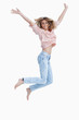 Woman jumping up with her arms raised